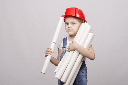 Girl Builder keeps a bunch of drawings and smilesの写真素材