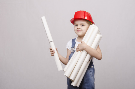 Girl Builder keeps a bunch of drawings and smilesの写真素材