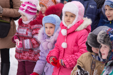 Volgograd, Russia - January 7, 2016: Two girls stand in a crowd of children on a small childrens New...