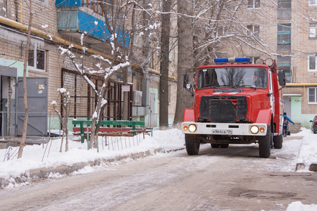 Volgograd, Russia - January 24, 2016: Car fire service Russian Ministry of Emergency Situations arrived on the challenge on suspicion of fire in high-rise apartment buildingのeditorial素材