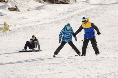 Dombay, Russia - February 7, 2015: The instructor teaches how to ski on snow downhill ski training on the resort Dombayのeditorial素材