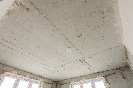 Concrete ceiling of a monolithic house close-up in a new buildingの写真素材