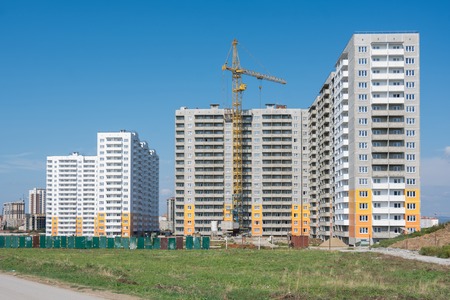 Construction of a residential complex of typical sixteen-storey block houses