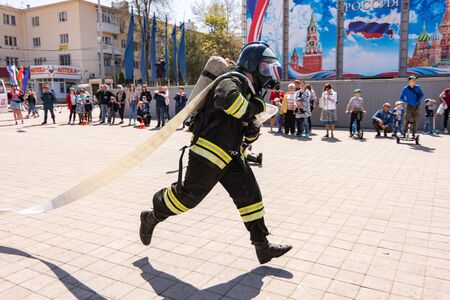 Anapa, Russia - April 27, 2019: Anapa fire-technical exhibition at the Theater Square in Anapa, dedicated to the 370th anniversary of the Russian fire brigade, Demonstration performances of the fire department employee EMERCOM of Russiaのeditorial素材