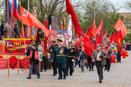 Anapa, Russia - May 9, 2019: At the Victory Day parade are representatives of the Communist Party,...