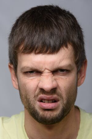 Closeup portrait of an evil man of European appearanceの写真素材