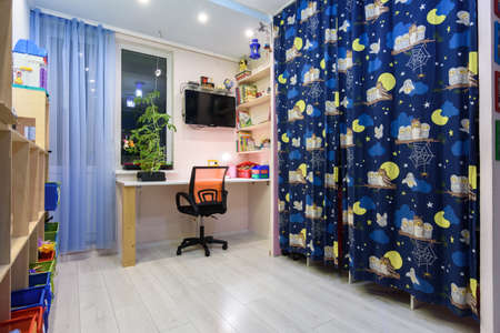 Anapa, Russia - April 2, 2020: Living room interior with a large closet covered with curtainsのeditorial素材