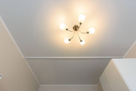 Classic matte stretch ceiling divided into two parts of the guide for curtainsの写真素材