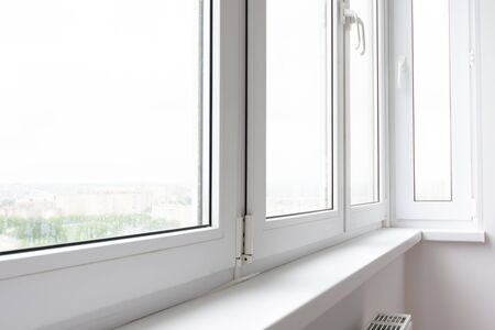 Plastic window sill on a balcony glazed with plastic windows