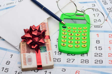 Gift for the future headman, a bundle of money with a red bowの写真素材