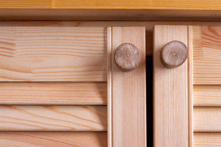 wooden homemade handles on the wooden facades of the kitchen setの写真素材