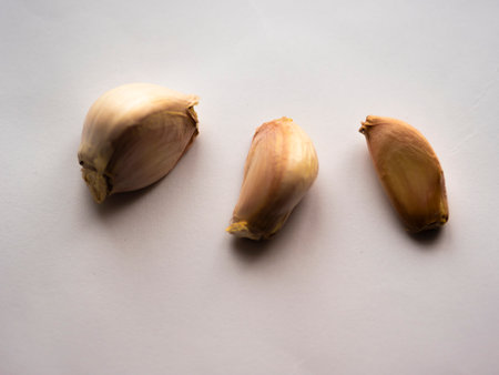 cloves of garlic. Isolated garlic. Raw garlic segment isolated on a white background, with the path cut offの写真素材