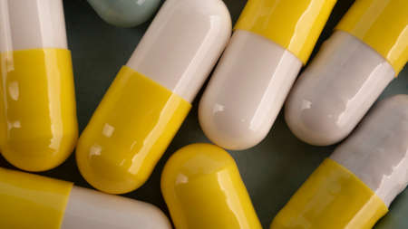 Pills. Capsules. Vitamins. Colored pills. A bunch of tablet pillsの写真素材