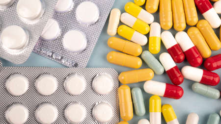 Pills. Capsules. Vitamins. Colored pills. A bunch of tablet pillsの写真素材