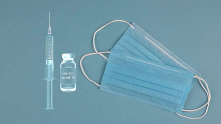 The syringe and vaccine from COVID-19 and the mask is protective. Health care and medical concept.の写真素材