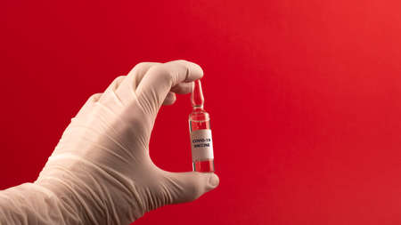 Vaccine vial dose flu shot drug needle syringe,medical concept vaccination hypodermic injection treatment disease care hospital prevention immunization illness disease baby child.blue backgroundの写真素材