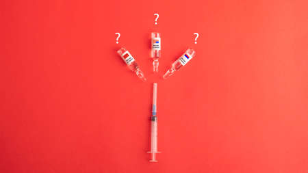 Vaccine vial dose flu shot drug needle syringe,medical concept vaccination hypodermic injection treatment disease care hospital prevention immunization illness disease baby child.blue backgroundの写真素材