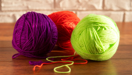 Clew of green thread for knitting isolated on white backgroundの写真素材