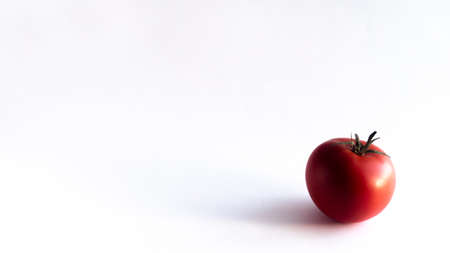 a ripe orange isolated on a yellow background, on a green background, on a red background, on a combined backgroundの写真素材