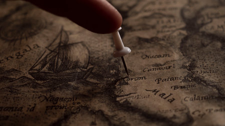 pin marking location on map. ancient map of the earth