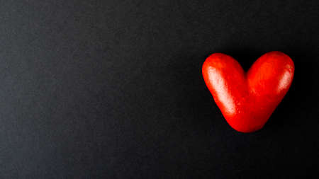 Valentines day concept. Handmade red hearts on a dark background. With place for your text.の写真素材