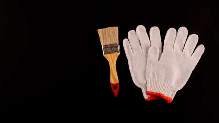 Essential Tools for Painting: paint rollers and tray, brush, masking tape, gloves, scissors.の写真素材