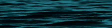 Dark blue green abstract background. Reflection of light on a smooth surface of water with small waves. Tidewater green background with copy space for design. Web banner.の写真素材
