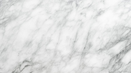 Smooth white marble surface features delicate gray veining, perfect for use in design projects, backgrounds, and luxury interior decor applicationsの写真素材