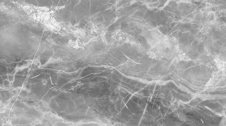 Gray marble texture features delicate veining and a polished surface, perfect for backgrounds, interior design, and artistic projects, enhancing visual appealの写真素材