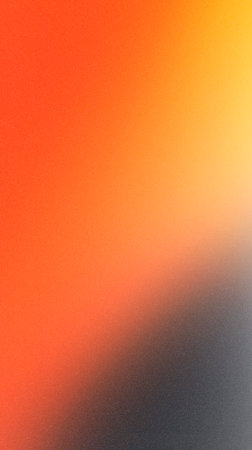 Vibrant abstract gradient background showing a blend of orange, yellow, and black colors, perfect for creative projects, digital designs, and artistic applicationsの写真素材
