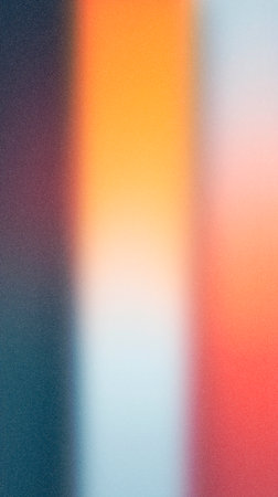 Vibrant abstract background with blurred colors of orange, red, and blue, creating a smooth gradient effect, perfect for artistic projects and creative designsの写真素材