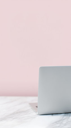 Stylish workspace setup, Sophisticated creative area with polished accessories, Chic entrepreneurial environment showcasing silver device against pastelcolored walls for brandingの素材