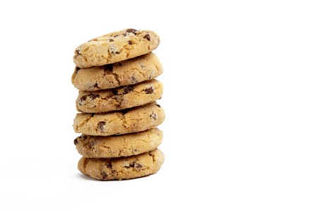 Chocolate Chip Cookies in a Pile on a White Isolated Backgroundの写真素材