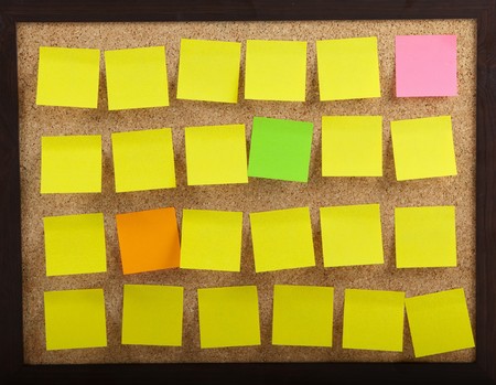 Colourful Notes On Brown Cork Board