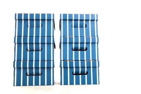 Two Piles of Colourful Cardboard Boxes on White Isolated Backgroundの写真素材