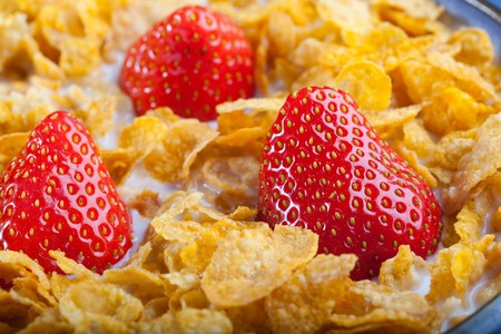 Cereal In A Bowl With Milk And Strawberriesの写真素材