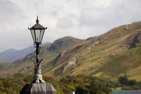Lantern With Cloudy Sky And Mountains In The Backgroundの写真素材