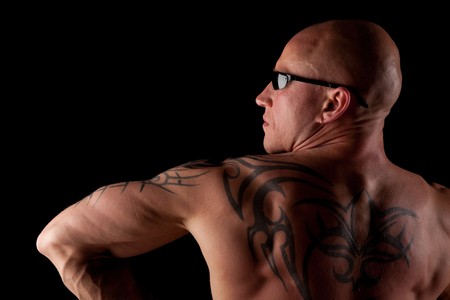 Fit Bodybuilder With Sunglasses On Black Isolated Backgroundの写真素材