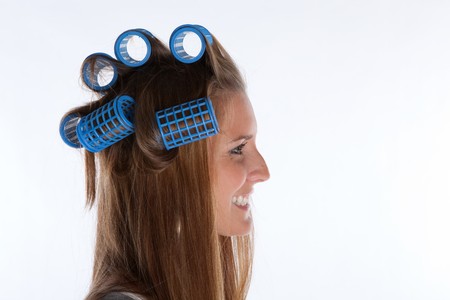 Housewife with Rolls in Her Hair on White Backgroundの写真素材