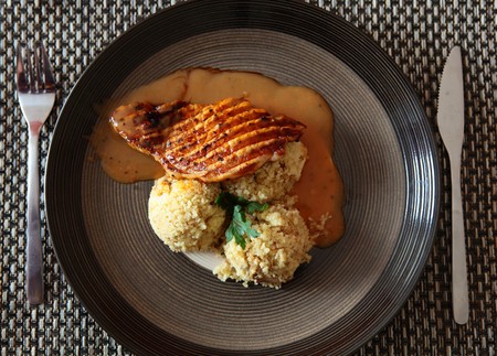 Pork With Pepper Sauce and Cous-Cous On a Plateの写真素材