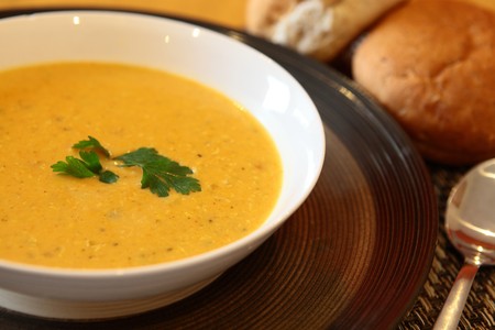 Hot Indian Chicken Soup in Bowl With Breadの写真素材