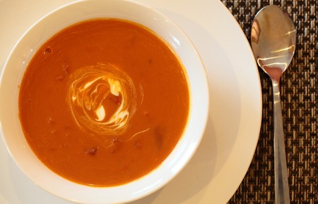 Hot Tomato Soup With Sour Cream In a Bowl with Spoonの写真素材