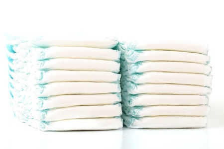 Two Stacks Of Baby Diapers On White Isolated Backgroundの写真素材