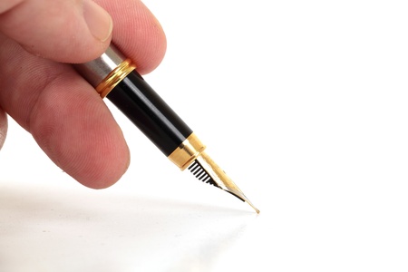 Hand Holding Fountain Pen On White Isolated Backgroundの写真素材