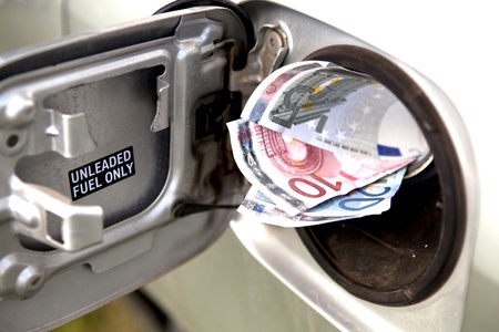 Euro Notes Sticking Out Of A Car Fueltankの写真素材