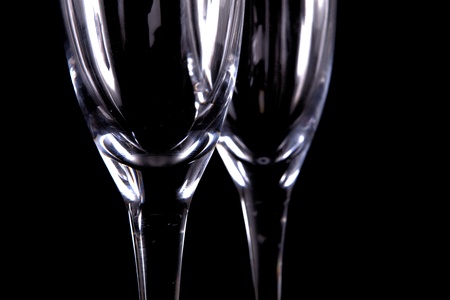 Two Living Crystal Champagne Glasses Isolated On Blackの写真素材