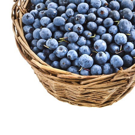 blueberry in basket isolated over a whiteの写真素材