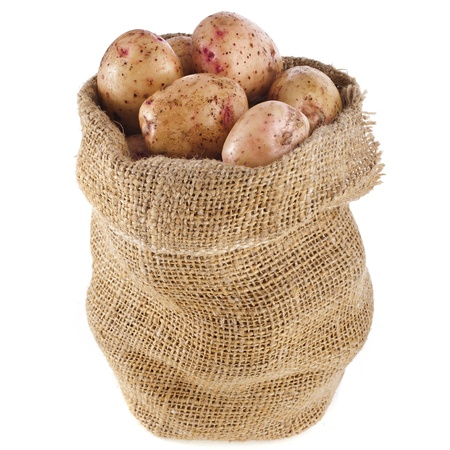 potatoes in burlap sack bag isolated over whiteの写真素材