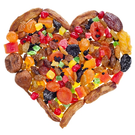 mix dried fruits heart shape isolated on white backgroundの写真素材