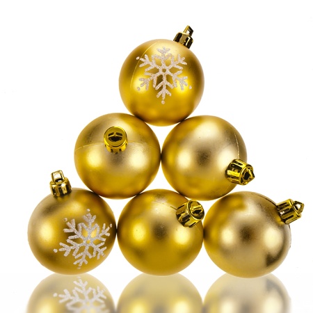 christmas golden bauble balls isolated on a white backgroundの写真素材